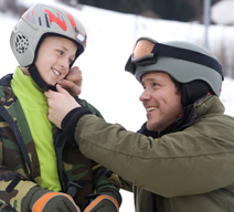 Putting helmet on child